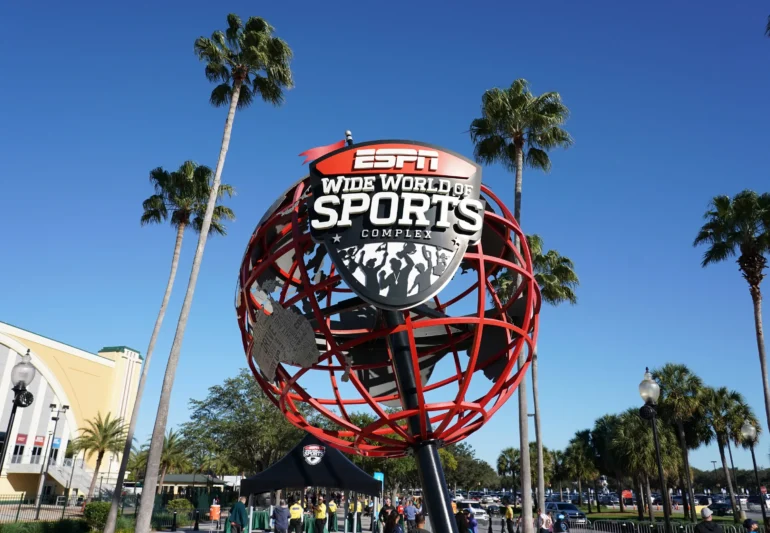 A large red globe with the words " wide world sports ".